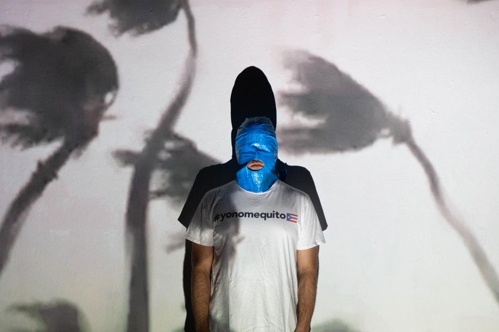 Self-portrait with blue tarp mask, 2019
